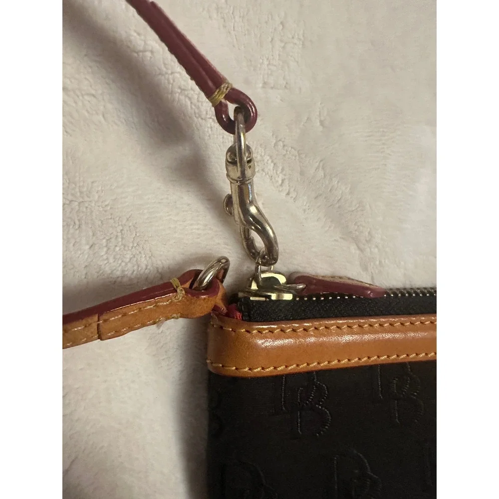 Dooney & Bourke Black Monogram Canvas Wristlet Pouch Tan Leather Trim Red Lining